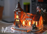 01.12.2020,  Weihnachts-Dekoration in einem Wohnzimmer in Bayern. Eine kleine Kirche von innen beleuchtet.