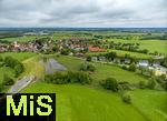 02.06.2024, Kirchheim bei Bad Wrishofen im Unterallgu, Nach dem Hochwasser nach andauernden Regenfllen ist das Wasser ber Nacht zgig abgelaufen. Hier in dem berlaufbecken fr eine Jahrhunderflut vor dem Dorf steht nur noch wenig Stauwasser, Tags zuvor ist der Damm ungeplant bergelaufen und hat den Kirchdorfern teils katastrophale Wasserschden beschert. Luftbild mit Drohne