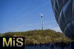 12.04.2025, Fussball 1. Bundesliga 2024/2025, 29. Spieltag,  FC Bayern Mnchen - Borussia Dortmund, in der Allianz-Arena Mnchen.   Windrad auf dem Berg gegenber 