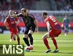 19.04.2025, Fussball 1. Bundesliga 2024/2025, 30. Spieltag, 1.FC Heidenheim - FC Bayern Mnchen, in der Voith-Arena Heidenheim. v.l. Harry Kane (FC Bayern Mnchen) gegen Patrick Mainka (1.FC Heidenheim) 

