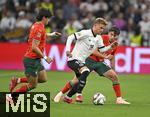 04.06.2025, Fussball UEFA Nations League 2024/25,  Halbfinale, Deutschland - Portugal, in der Allianz-Arena Mnchen. Maximilian Mittelstdt (Deutschland) setzt sich durch,