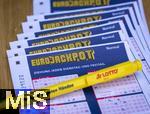 28.03.2023, Lotto Bayern, Eurojackpot-Scheine, Angekreuzte Tippscheine auf dem Tisch. 