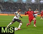 14.11.2025, Fussball WM-Qualifikation Europa 2025/26, 9.Spieltag,  Luxemburg - Deutschland, im Stade de Luxembourg (Croix de Gasperich, Luxemburg), v.l. Ridle Baku (Deutschland) gegen Aiman Dardari (Luxemburg) 