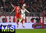 14.12.2025, Fussball Bundesliga 2025/2026, 14.Spieltag, FC Bayern M�nchen - 1.FSV Mainz 05, in der Allianz-Arena M�nchen,  v.li: Min-jae Kim (Bayern M�nchen, Minjae Kim) gegen Benedict Hollerbach (FSV Mainz) 


